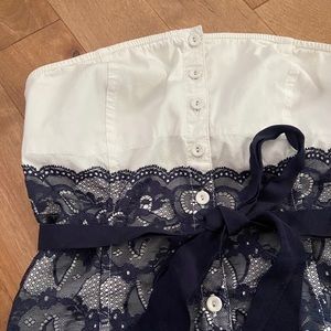 Cute button up lace strapless top